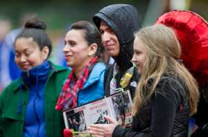 Juneau-Douglas' Oswaldo Magallanes is joined with his mother, Anna, second from left, sister, Ella, left, and girlfriend, Tina Tsyshevska, right, during senior night at Adair-Kennedy Memorial Park on Tuesday.