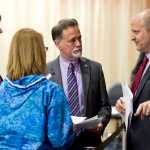 Tax Director Ken Alper, of the Alaska Department of Revenue, right, speaks with Sen. Peter Micciche, R-Soldotna, center, Sen. Anna MacKinnon, R-Eagle River, and Sen. Bill Wielechowski, D-Anchorage, as they work on amendments to the oil and gas tax credits bill on the 121st day of the legislative session on Wednesday.