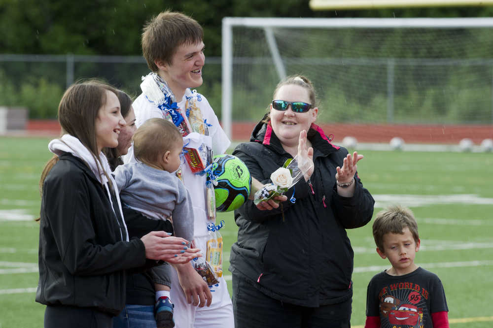 Andrew Clark is acknowledged with his family during Thunder Mountain Senior NIght at Thunder Mountain High School on Wednesday.