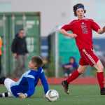 Juneau-Douglas' Brysen Mitchell, right, watches his ball roll into the goal after beating Thunder Mountain's goalie John Seymour during the game at TMHS on Wednesday.