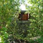 One of the pieces by Katie Craney, wallpaper designed onto the metal of a coal chute, is seen in the Historic Fort William H. Seward Interpretive Sculpture Garden.