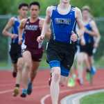 Thunder Mountain High School sophmore Jonah Penrose rounds a turn followed by Ketchikan's Sylvan Blankenship, left, during the finals of the 3200 meter run during the Region V Track and Field Championships at TMHS on Friday. Penrose and Blankenship held their positions to finish in first and second place.