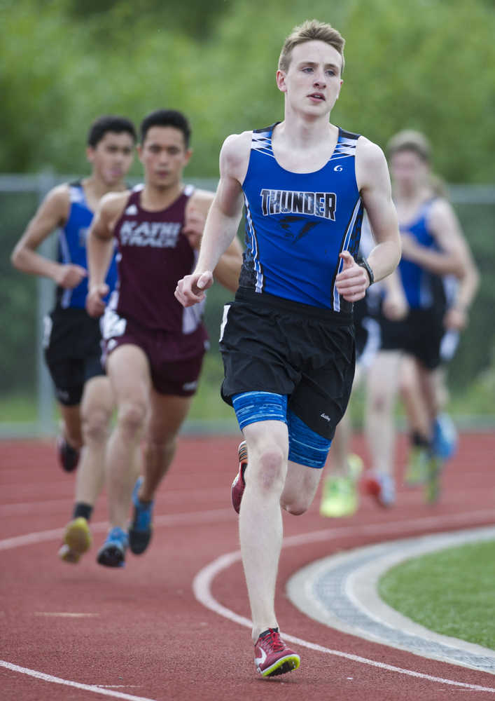 Thunder Mountain High School sophmore Jonah Penrose rounds a turn followed by Ketchikan's Sylvan Blankenship, left, during the finals of the 3200 meter run during the Region V Track and Field Championships at TMHS on Friday. Penrose and Blankenship held their positions to finish in first and second place.