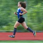 Thunder Mountain's Erin Wallace strides to a win in the girl's 3200 meter race during the Region V Track and Field Championships at TMHS on Friday.