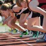 Runners take off from their starts during their 100 meter event Saturday morning at Thunder Mountain Field.