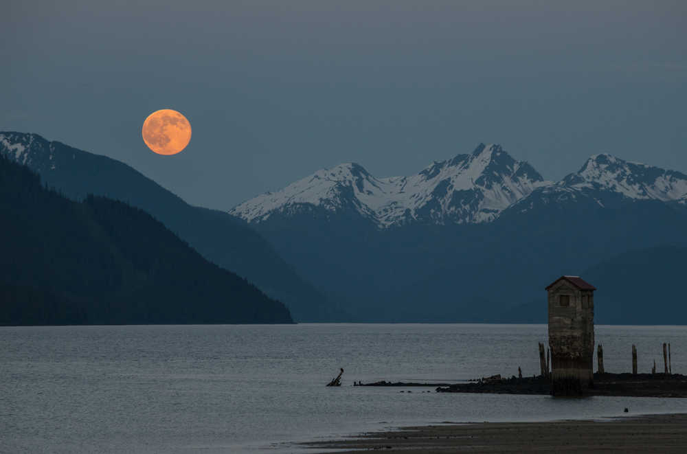 An orange full moon rises on May 21.
