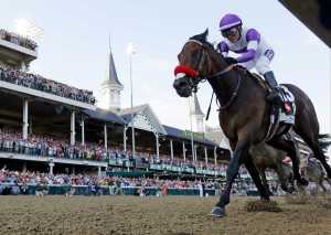 FILE - In this May 7, 2016, file photo, Mario Gutierrez rides Nyquist to victory during the 142nd running of the Kentucky Derby horse race at Churchill Downs in Louisville, Ky. The trainer of Nyquist says the Kentucky Derby winner is sick and won't run in the Belmont Stakes on June 11. Doug O'Neill said Tuesday, May 24, 2016,  that Nyquist is "out because of sickness." (AP Photo/David J. Phillip, File)