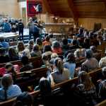 Juneau Community Charter School teachers Jenny Strumfeld and Steve Morley present their eighth grade students during the Moving On Ceremony at Northern Light United Church on Wednesday.