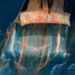 Under the docks-patterns on a ship's hull. Photo by Kerry Howard.