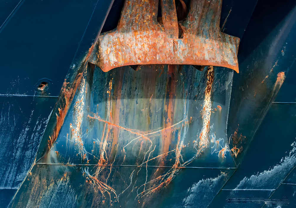 Under the docks-patterns on a ship's hull. Photo by Kerry Howard.