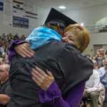 Hunter Pegues hugs his mother, Kelli Manchester, after his speech during the graduation ceremony Sunday at Juneau-Douglas High School.