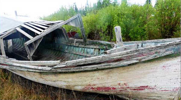 A deserted wooden boat has been left to nature's devices in Destruction Bay. Photo by Denise Carroll.