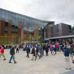 Juneau residents and visitors gather in front of the Andrew P. Kashevaroff State Library, Archives and Museum for the grand opening on Monday.