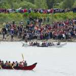 Canoes enter Douglas Harbor for a Coming Ashore Ceremony sponsored by the One People Canoe Society on Wednesday.