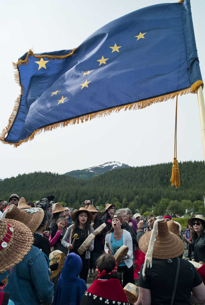 Members of the Yees Ku.oo Dance Group sing and drum during a Coming Ashore Ceremony at the Douglas Harbor on Wednesday.