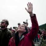 Katherine Howard of Angoon reacts to the music during the Coming Ashore Ceremony at Douglas Harbor sponsored by the One People Canoe Society on Wednesday.