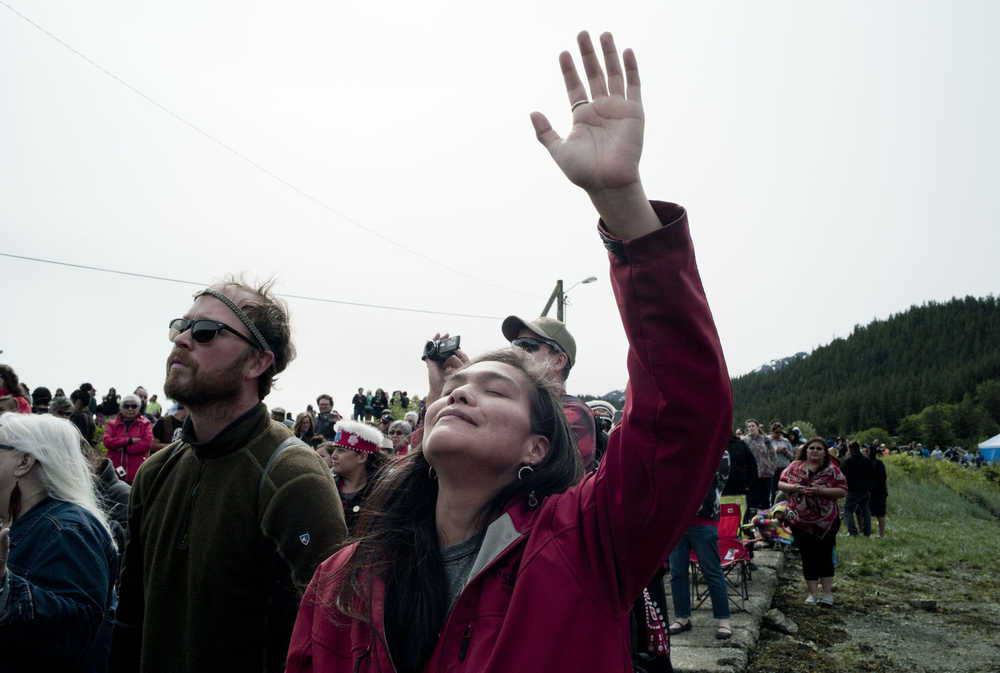 Katherine Howard of Angoon reacts to the music during the Coming Ashore Ceremony at Douglas Harbor sponsored by the One People Canoe Society on Wednesday.
