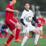 Juneau-Douglas' Ezra Geselle, left, competes against Thunder Mountain's Michael Alon during a game at TMHS in May.