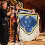 Clarissa Rizal, left, talks about weaving the Thunderbird Chilkat robe during Celebration's Ravenstail & Chilkat Weavers Symposium inside the Walter Soboleff Building's clan house Wednesday.