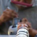 Jeffery Sheakley of Sitka works on a silver bracelet at the Northwest Coast Art Market at Sealaska Plaza during Celebration 2016 on Thursday.