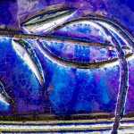 Colorful detail from an old flower pot. Photo by Kerry Howard.