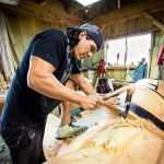 TJ Young carves a totem pole at the 2015 Culture Camp in Hydaburg.