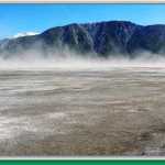 The wind blowing over the sandy section of Kluane Lake creates a duststorm visible for miles.