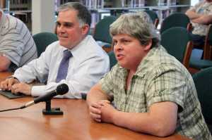 Two members of the teacher contract negotiation team - Juneau School District Director of Human Resources Ted Van Bronkhorst and Juneau Education Association president-elect Laura Mulgrew - talk to the Juneau School Board at Tuesday night's regular meeting.