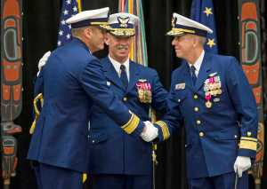 Rear Admiral Michael McAllister, left, takes over as Commander of the U.S. Coast Guard 17th District from Rear Admiral Daniel Abel, right, during a Change of Command ceremony at Elizabeth Peratrovich Hall on Wednesday. The ceremony was overseen by Vice Admiral Charles Ray, Commander of the Pacific Area and Defense Force West, center.