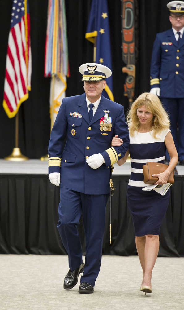 Rear Admiral Michael McAllister, escorts his wife, Bridget, after taking over Commander of the U.S. Coast Guard 17th District from Rear Admiral Daniel Abel during a Change of Command ceremony at Elizabeth Peratrovich Hall on Wednesday. The ceremony was overseen by Vice Admiral Charles Ray, Commander of the Pacific Area and Defense Force West.