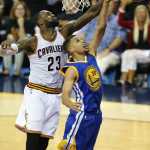 Cleveland Cavaliers forward LeBron James (23) blocks a shot by Golden State Warriors guard Stephen Curry (30) during the second half of Game 6 of basketball's NBA Finals in Cleveland, Thursday, June 16, 2016. (AP Photo/Ron Schwane)