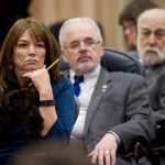 House Majority Leader Charisse Millett, R-Anchorage, left, Rep. Bob Herron, D-Bethel, and Rep. Bob Lynn, R-Anchorage, listen to a speech during the House session on Friday.