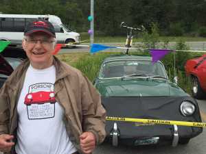 Steve Wolf with his car in the background.