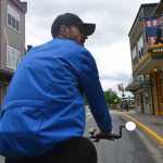 Kris McClure sits astride one of his three pedicabs. McClure started Alaska Pedicab last fall. Now in its first season, the business offers shuttle rides and downtown tours to locals and cruise passengers alike.