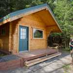Kevin Murphy, right, chief ranger for the southeast area of Alaska State Parks, and Doug Drexel, southeast maintenance chief, view the new Salamander Cabin on Shelter Island on Thursday.