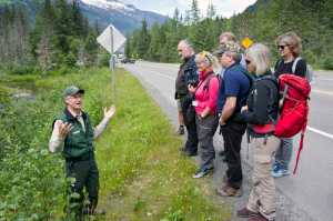John Neary, director of the Mendenhall Glacier Visitor Center, gives a tour to a Norwegian tourism industry delegation on Monday. The group is the studying tourism in Southeast Alaska.