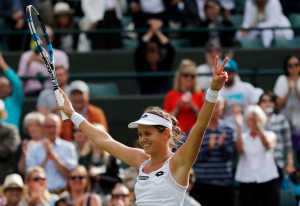 Jana Cepelova of Slovakia celebrates after beating Garbine Muguruza of Spain in their women's singles match on day four of the Wimbledon Tennis Championships in London, Thursday, June 30, 2016. (AP Photo/Ben Curtis)
