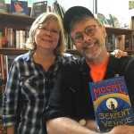 Internationally best-selling author Christopher Moore and Hearthside Books owner Brenda Weaver pose with Moore's 2014 book "The Serpent of Venice." Moore is in Juneau to visit friend, reknowned whale photographer and Juneau resident Flip Nicklin, whom Moore got to know while researching his 2003 book "Fluke, or, I Know Why the Winged Whale Sings." Mary Catharine Martin | Capital City Weekly