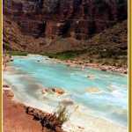 The turquoise waters of the Little Colorado River flow into the large Colorado River.