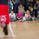 Children participating in the Wellness Wednesdays program at the Douglas Public Library watch Juneau Jumper Amy Schoonover, 14, as she performs her routine on Wednesday.
