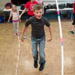 Elijah Goins, 9, learns how to double-dutch from members of the Juneau Jumpers during a Wellness Wednesdays program at the Douglas Library on Wednesday.