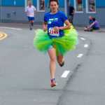 Womens winner April Rezendez leads the pack at the Glenn Frick Memorial Mile race on Sunday.
