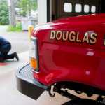 Volunteer firefighter Kristi Asplund maintains a chainsaw as part of her duties for living at the Douglas Fire Station.