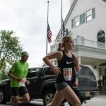 Runners pass the Governor's Mansion during the Governor's Cup 5K race Saturday morning.