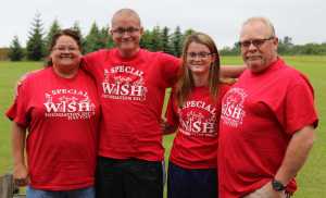 In this undated photo, Robin, left to right, David, April and Doug Stammen pose for a photo outside where they stayed at Bear Canyon Cottages in Homer. The Stammens were sent to Homer by A Special Wish Foundation to fulfill 16-year-old David's wish to halibut fish in Alaska.