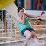 Jasz Garrett, 15, exits the water slide at the 6th Annual Rotary Day at the Pool at the Dimond Park Aquatic Center on Saturday afternoon. The pool held three free swims, with over 100 attendees at each swim. The swim was sponsored by the Glacier Valley Rotary Club, the Glacier Swim Club, and Juneau Parks and Recreation.