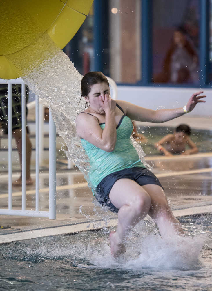 Jasz Garrett, 15, exits the water slide at the 6th Annual Rotary Day at the Pool at the Dimond Park Aquatic Center on Saturday afternoon. The pool held three free swims, with over 100 attendees at each swim. The swim was sponsored by the Glacier Valley Rotary Club, the Glacier Swim Club, and Juneau Parks and Recreation.
