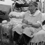 Minnie Gray, Nick Jans' Eskimo mom, works on a subsistence gillnet in her Ambler home. "The Giant's Hand" is dedicated to her.