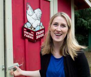 Crystal Schmitz at her backyard chicken coop on Dogwood Lane in the Mendenhall Valley on Friday. Schmitz has been raising chickens since April 2015.