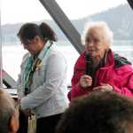 The Douglas Indian Association hosted an all-day boat trip to former Native village sites and the Taku Inlet on Friday. In this photo, Tlingit elder Marie Olson welcomes everyone to the homeland of the A'akw Kwáan. DIA tribal administrator Andrea Cadiente-Laiti stands next to her. 